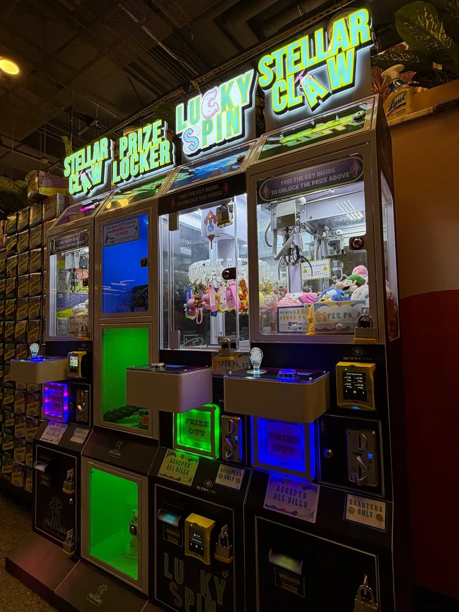 A real four-machine venue setup with two Stellar Claw games, Lucky Spin, and a prize locker